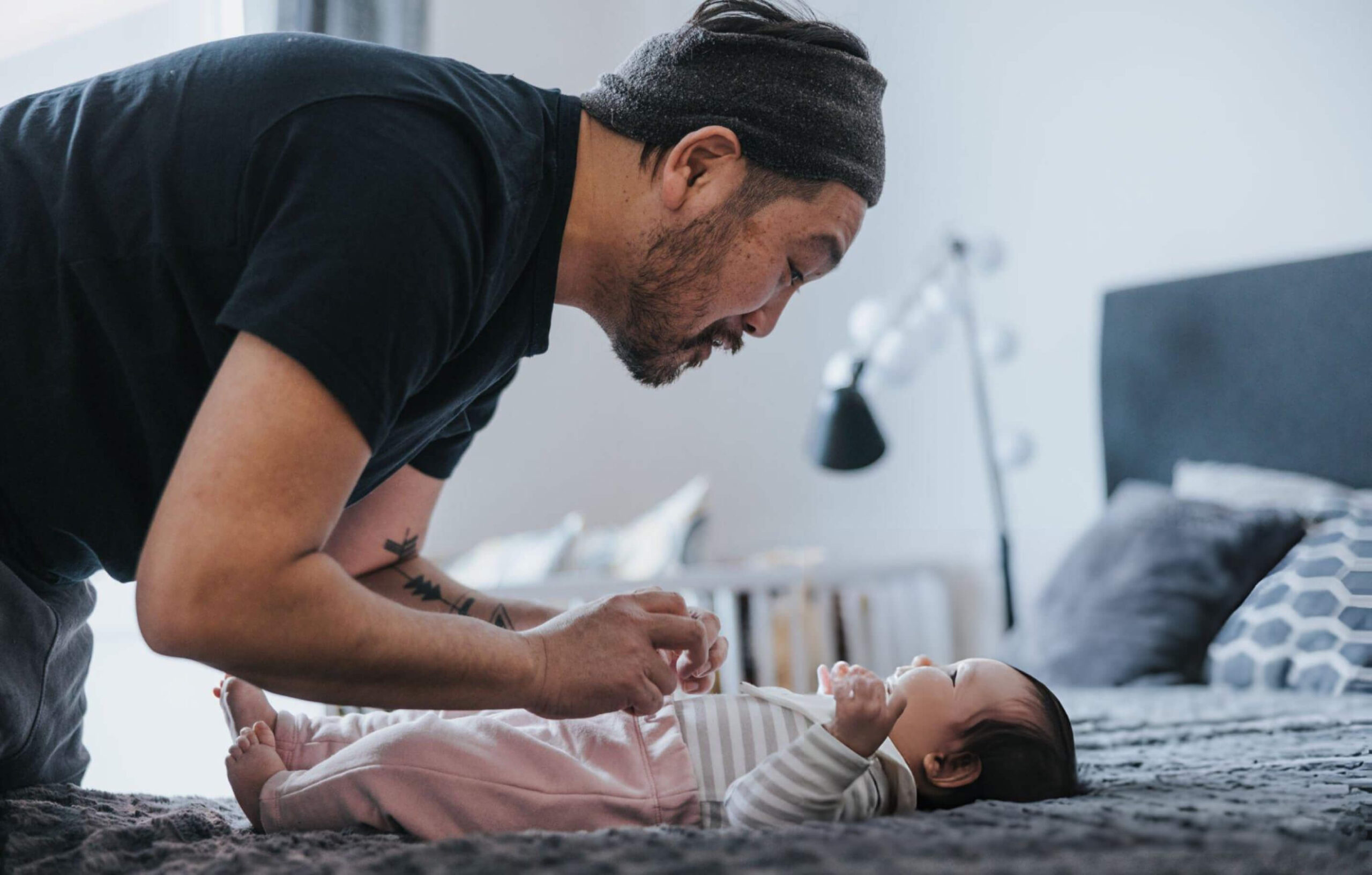 Japanese father and his babygirl spending time together at home.